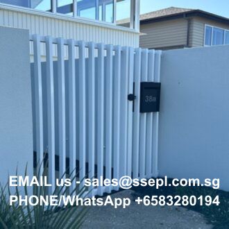 White vertical-slatted gate with a small black mailbox on the right; overlaid contact text reads: 'EMAIL us - sales@ssepl.com.sg PHONE/WhatsApp +6583280194'