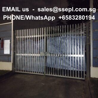 Locked metal gate at a gated entrance with a white text overlay showing an email address and a phone/WhatsApp number.