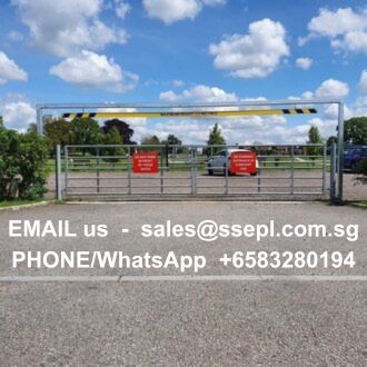 Metal gate across a parking lot with two red warning signs; overlaid text shows contact info: 'EMAIL us - sales@ssepl.com.sg' and 'PHONE/WhatsApp +6583280194'