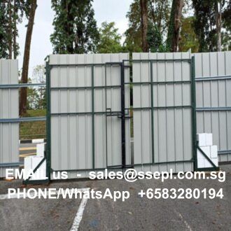 Metal gate with gray corrugated panels in a parking area, overlaid with white text showing contact info: 'EMAIL us sales@ssepl.com.sg' and 'PHONE/WhatsApp +6583280194'.